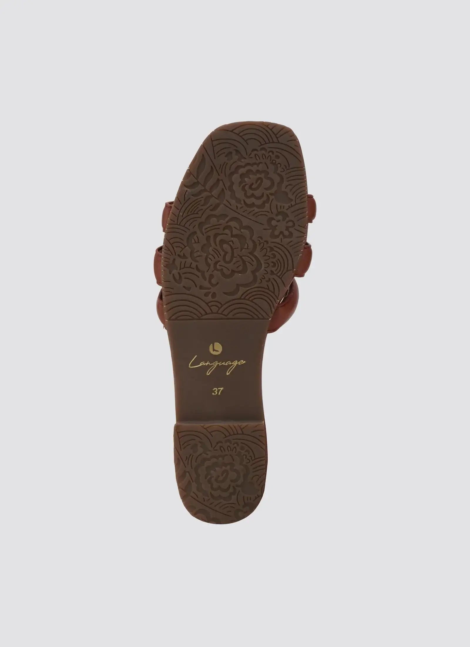 Brown sandal sole with floral embossed pattern and size marking, isolated on white background 