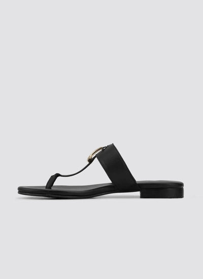 Black flat leather thong sandal with gold buckle detail for women on white background 