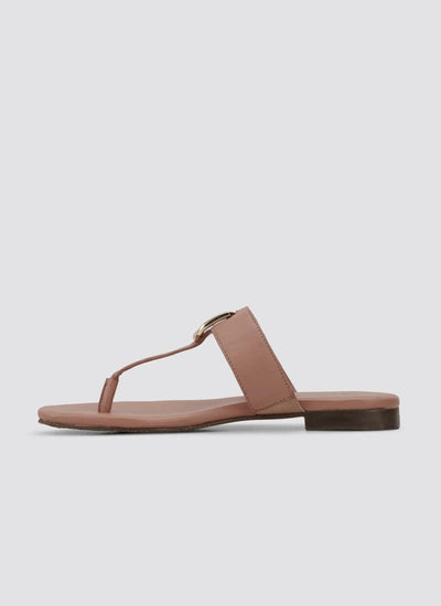 Women's pink leather flat sandal with toe loop and gold buckle, side view 
