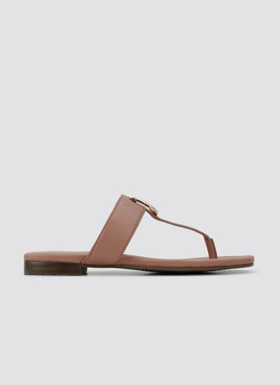 Women's pink leather flat sandal with toe loop and gold buckle detail, side view 