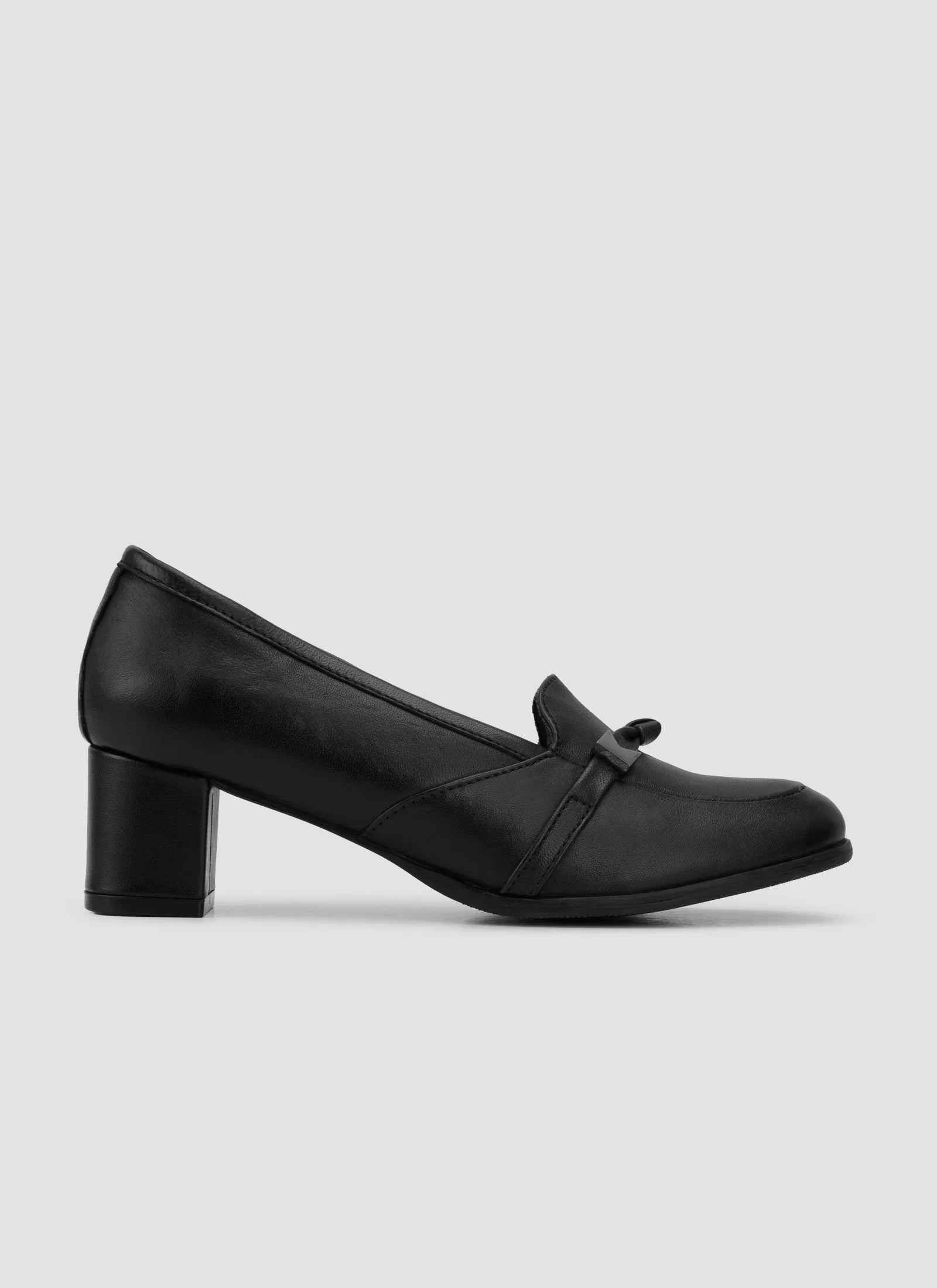 Black leather women's block heel loafer with bow detail on plain background 