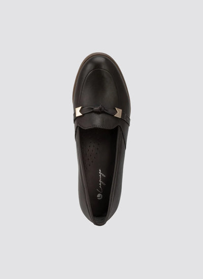 Brown leather loafer with gold hardware and bow detail, top view on light background 