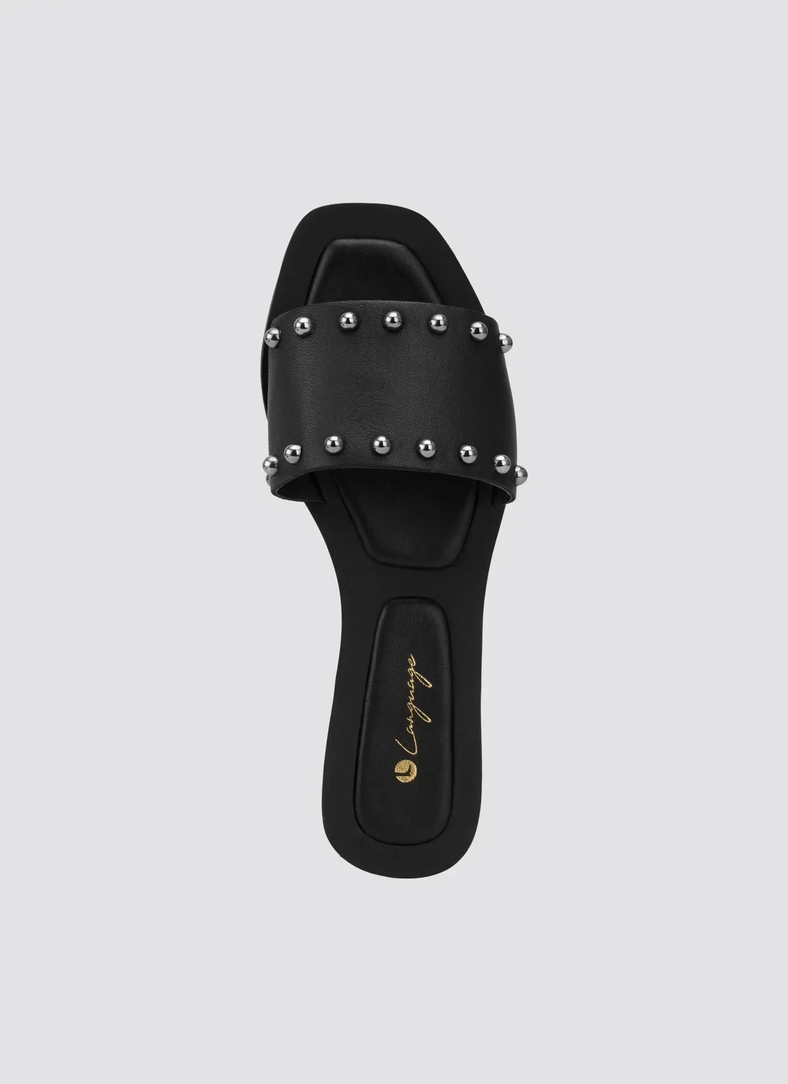 Black leather slide sandal with silver studs and square toe, top view 