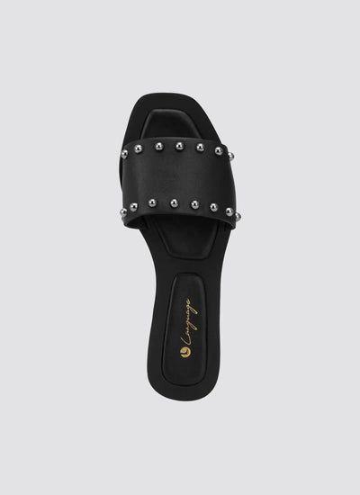 Black leather slide sandal with silver studs and square toe, top view 