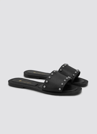 Black flat slide sandals with silver stud detailing for women, side perspective 