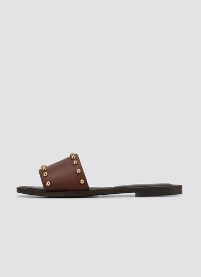 Brown flat sandal with gold stud accents for women, slip-on footwear profile 