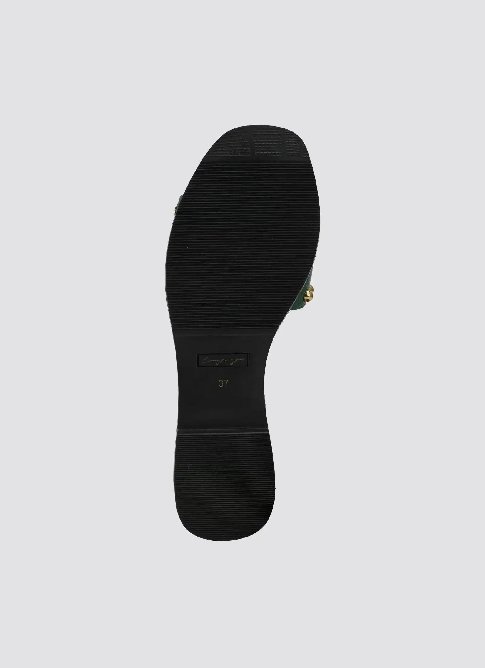 Black rubber sole of a women's loafer shoe, size 37, with gold accents visible on the side. 