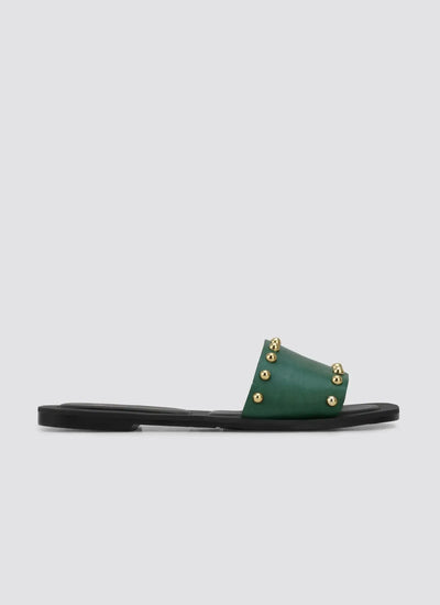Green leather studded flat sandal with gold accents on black sole, side view 
