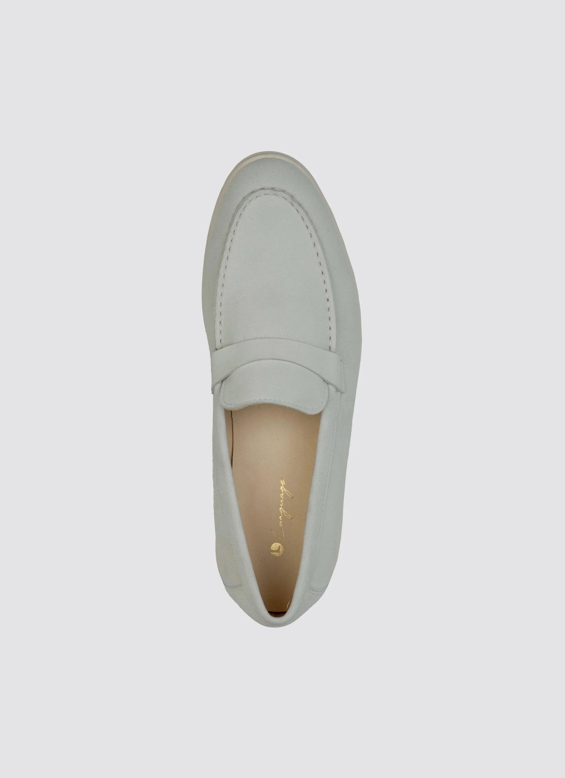 Top view of an off-white leather loafer for men on a plain background  