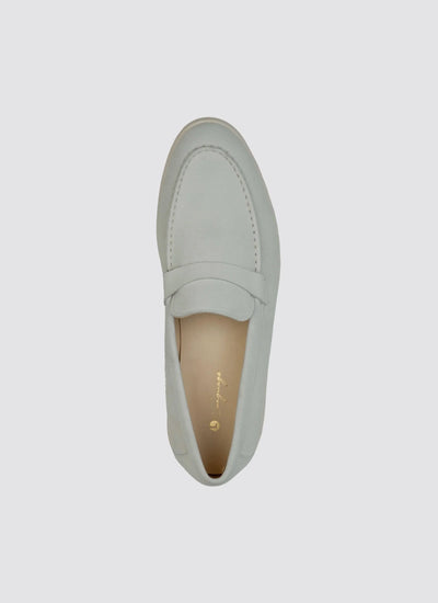 Top view of an off-white leather loafer for men on a plain background  