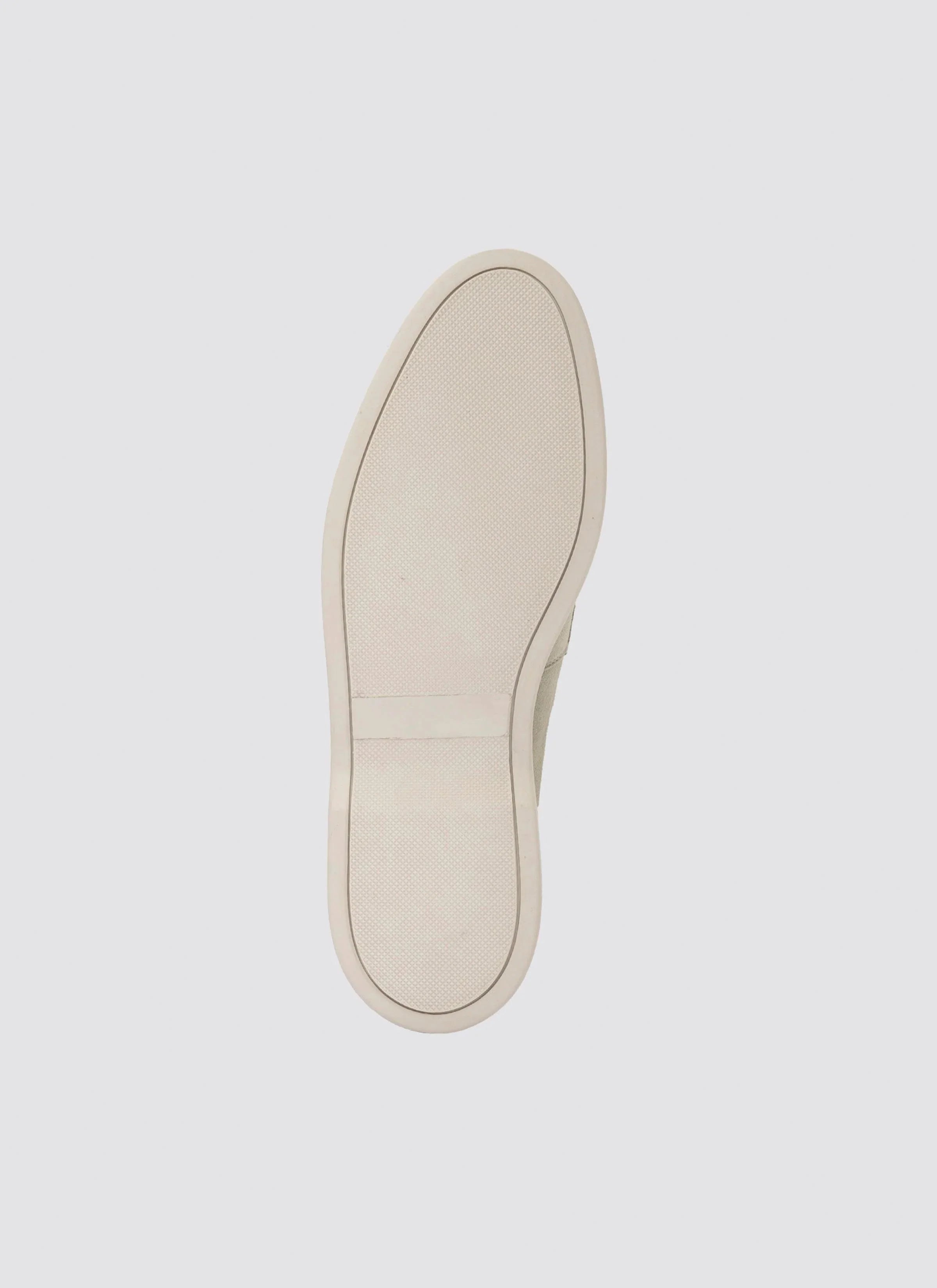 Beige casual sneaker sole with textured rubber grip on a plain background 