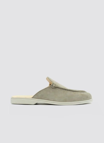 Light olive green suede loafer mule for men with white sole, side view on white background 