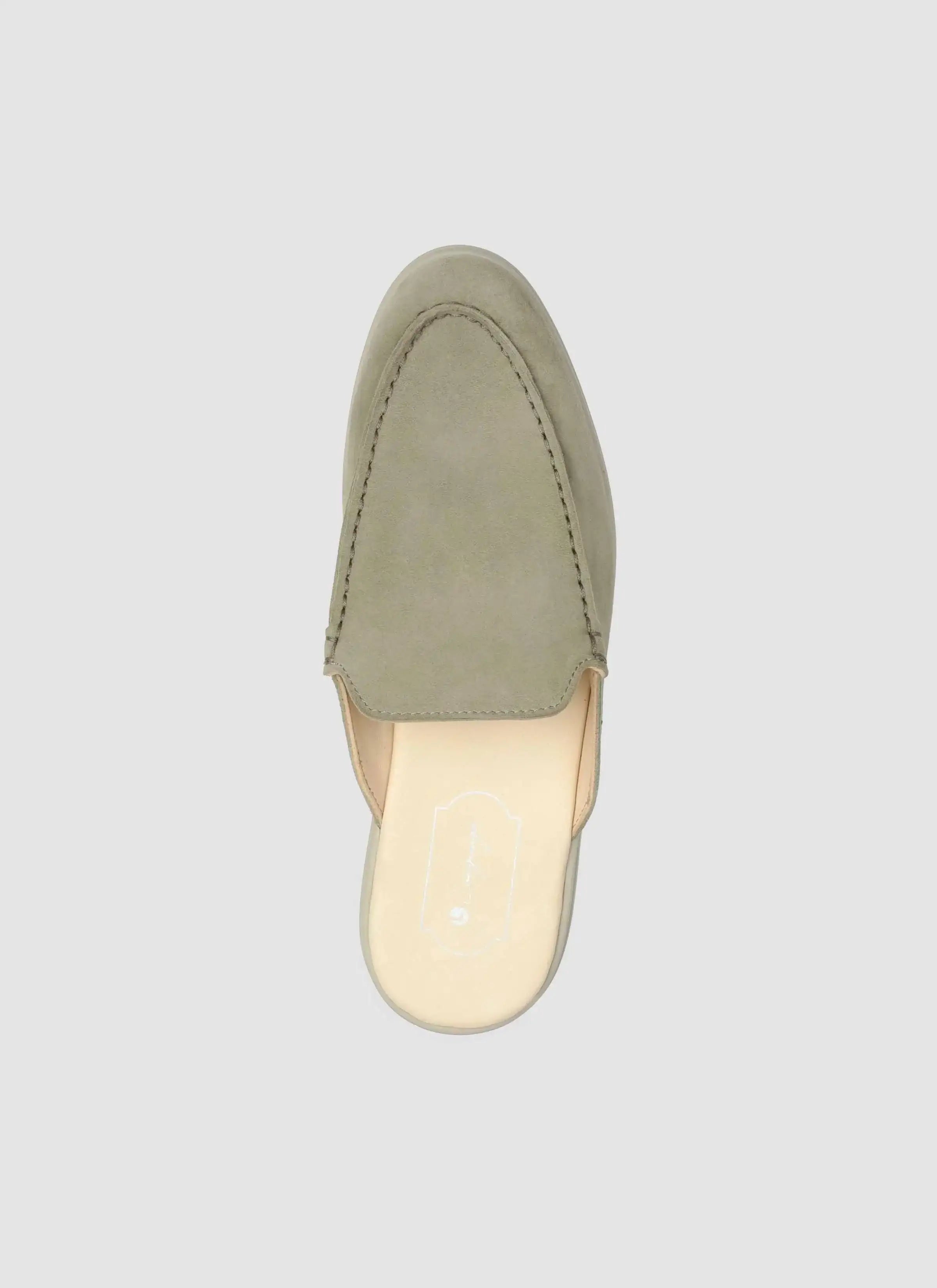 Light olive suede leather mule shoe, slip-on loafer style, top view on white background 