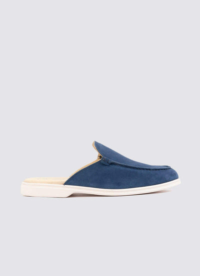 Men's navy blue suede slip-on mule with white sole, casual footwear on light background 