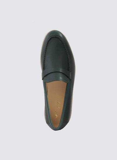 Top view of a forest green leather loafer shoe with stitched detailing on a plain background 