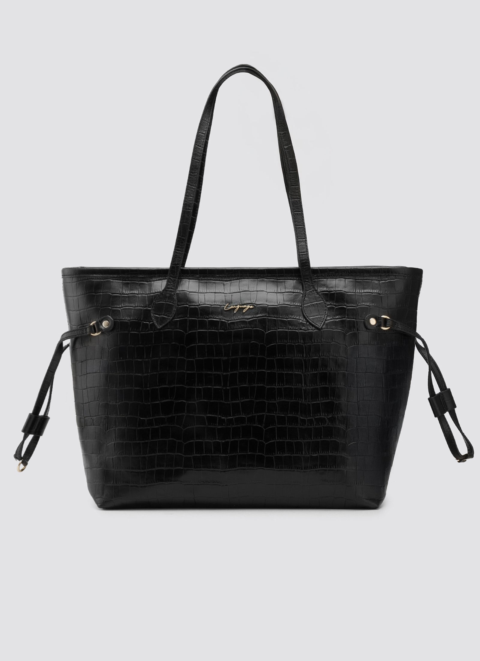 Black textured handbag on a light gray background 