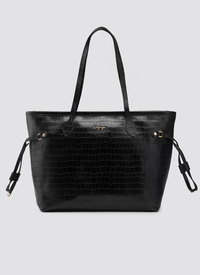 Black textured handbag on a light gray background 