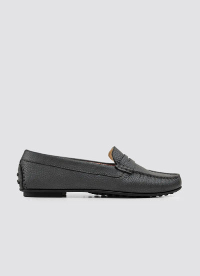 Black loafer shoe on a light gray background 