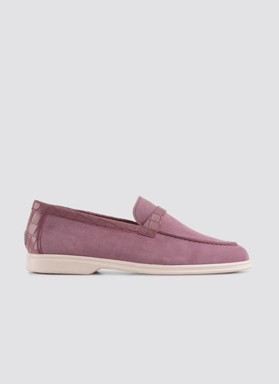 Purple loafer shoe on a light gray background 