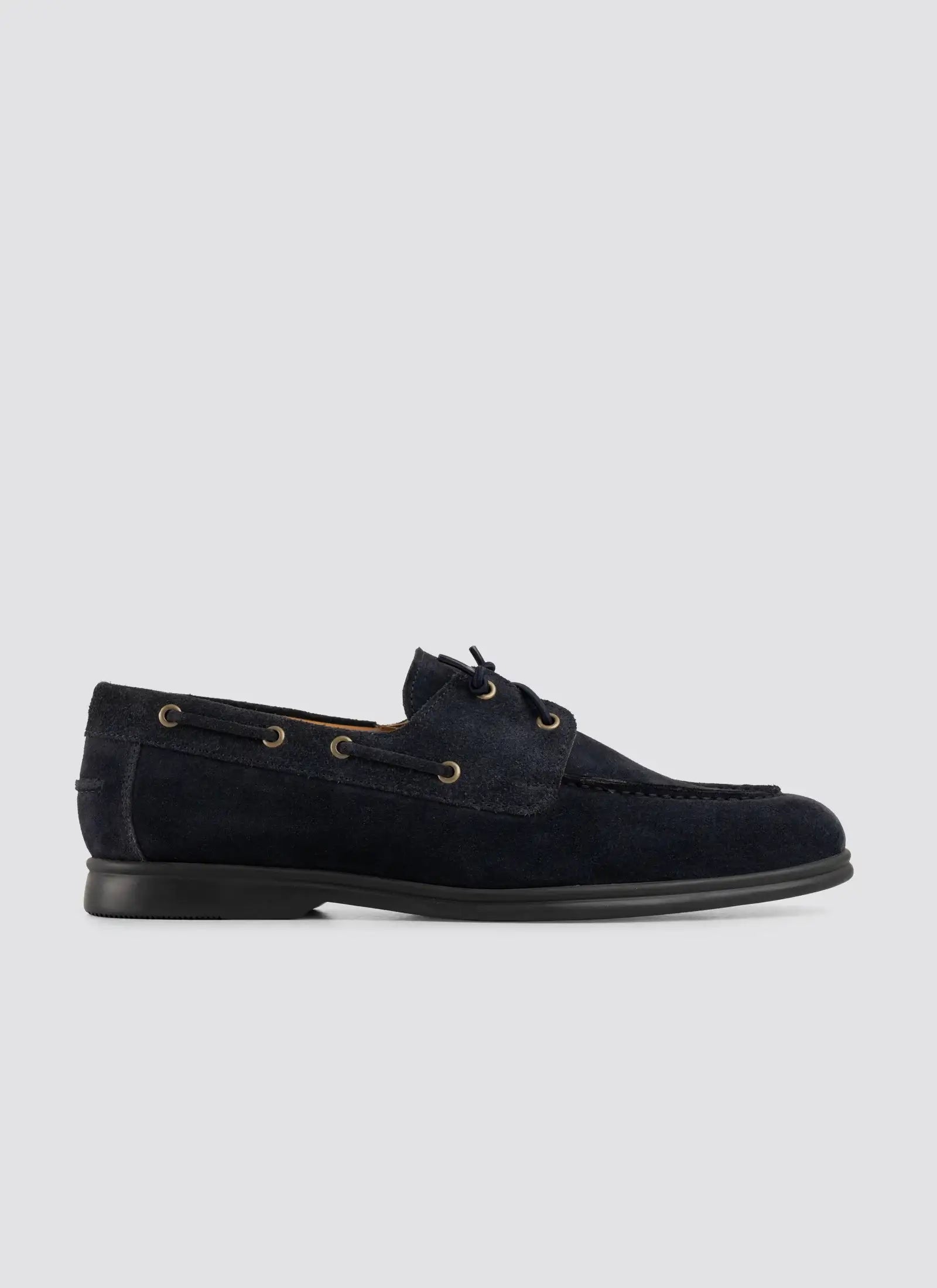 Men's navy blue suede boat shoe with lace-up detail and rubber sole on a plain background 