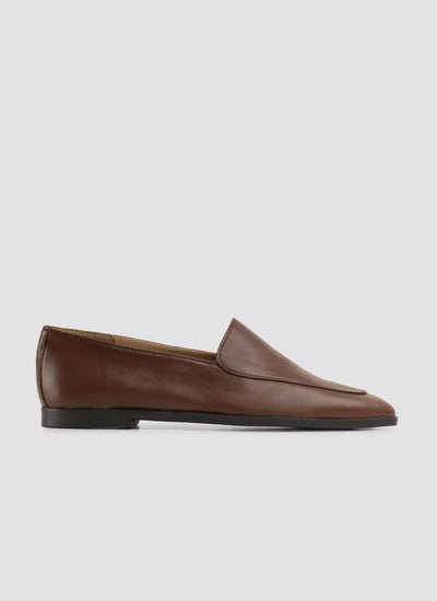 Brown loafer shoe on a light gray background 
