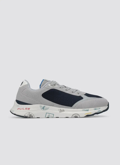 Grey and navy blue men's sneaker with travel stamp print sole, side view on white background 