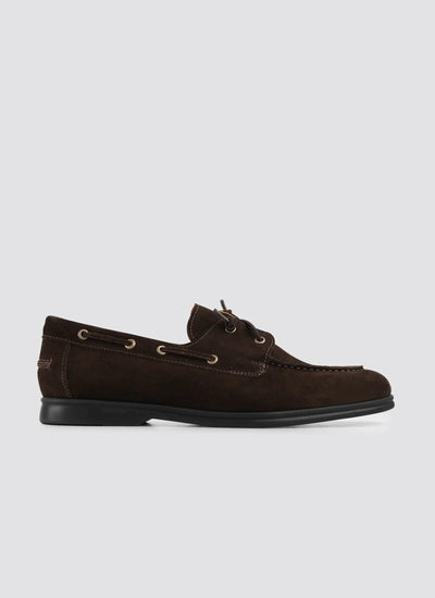Men's brown suede moccasin loafer with lace accents and black sole on white background 