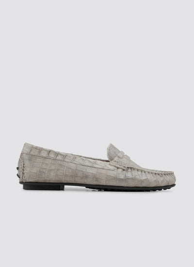 Gray loafers with a textured pattern on a white background 