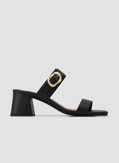 Black block heel sandal for women with gold buckle and open toe design on white background  