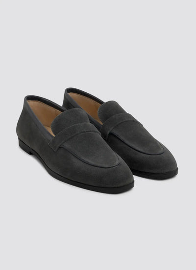 Black patent leather shoes on a white background 