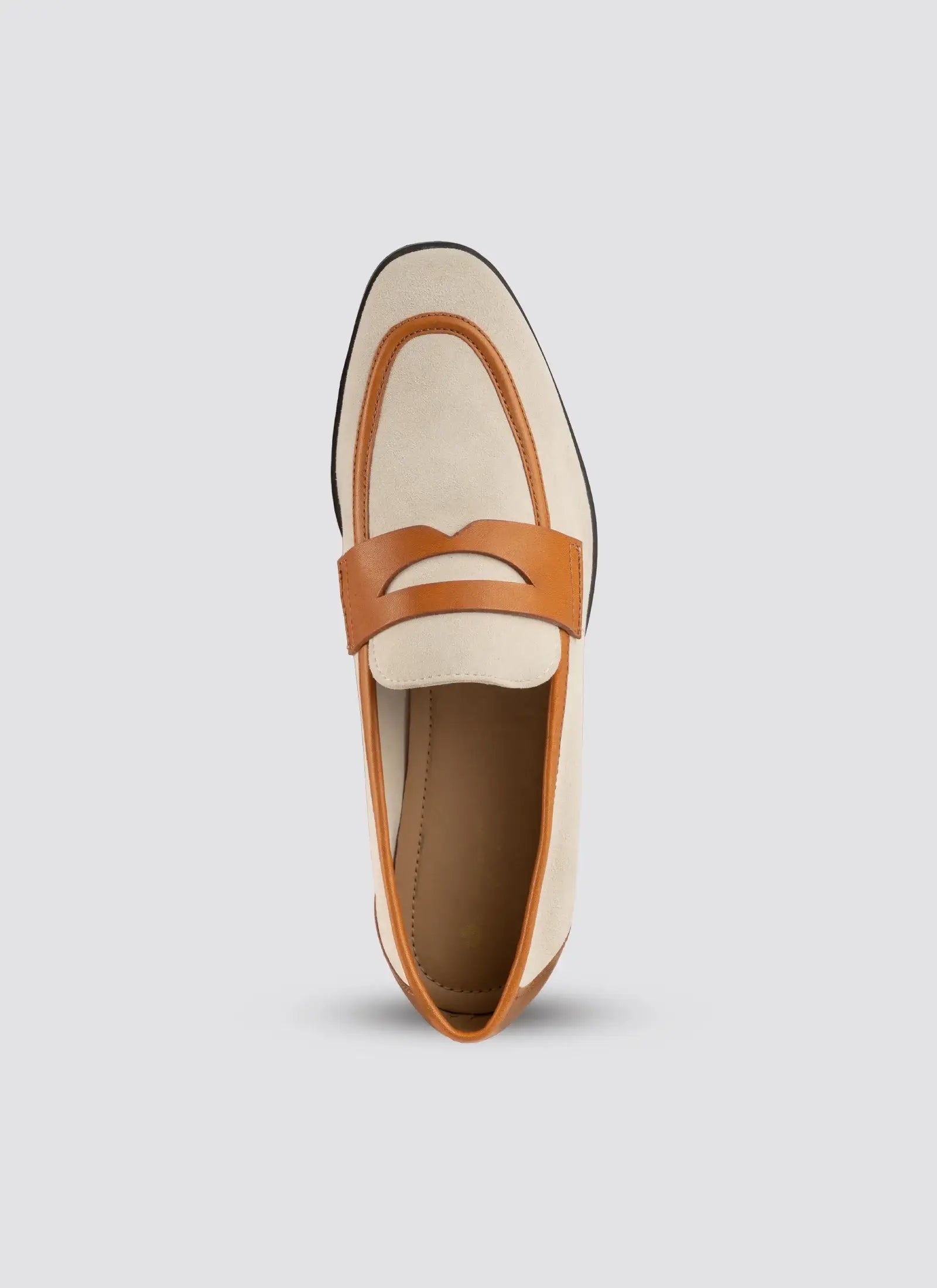 Loafer shoe with tan strap on a light gray background 