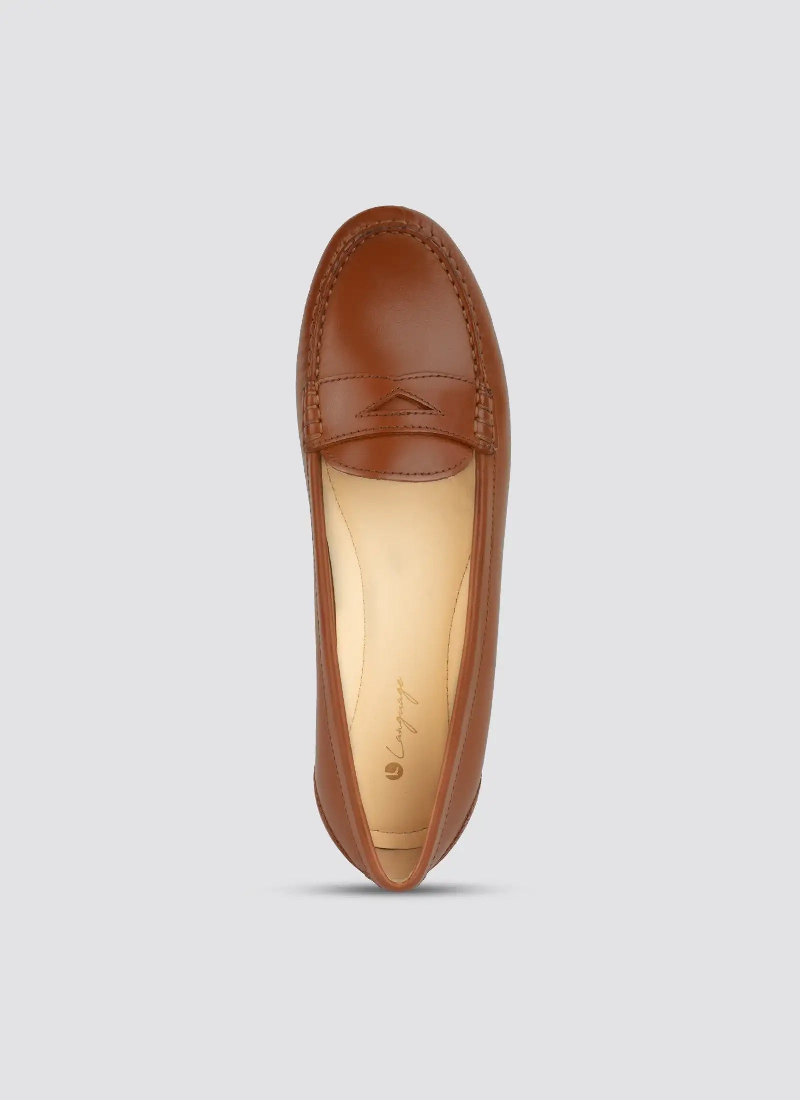 Brown leather loafer on a light gray background  
