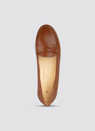 Brown leather loafer on a light gray background  